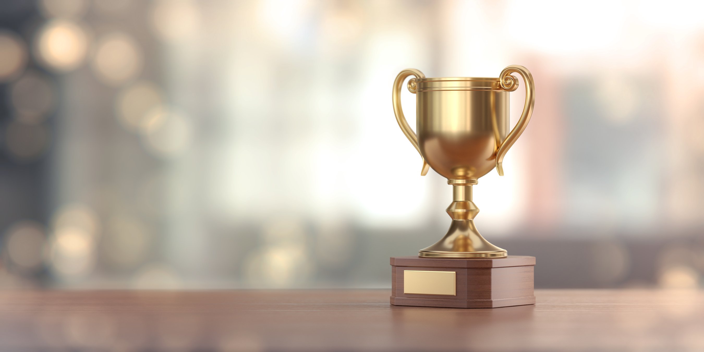 Gold Award Cup Against Defocused Background